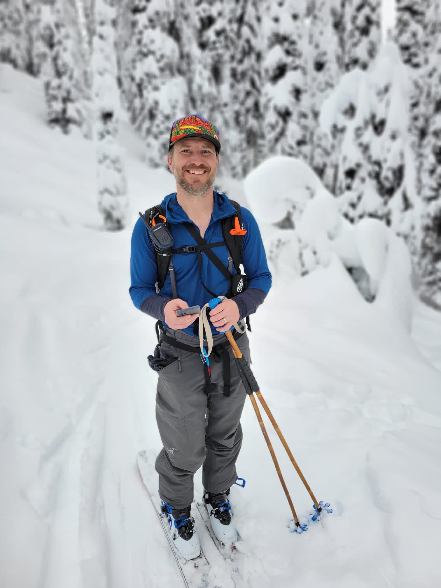 JB Leach backcountry ski touring, wearing avalanche safety gear